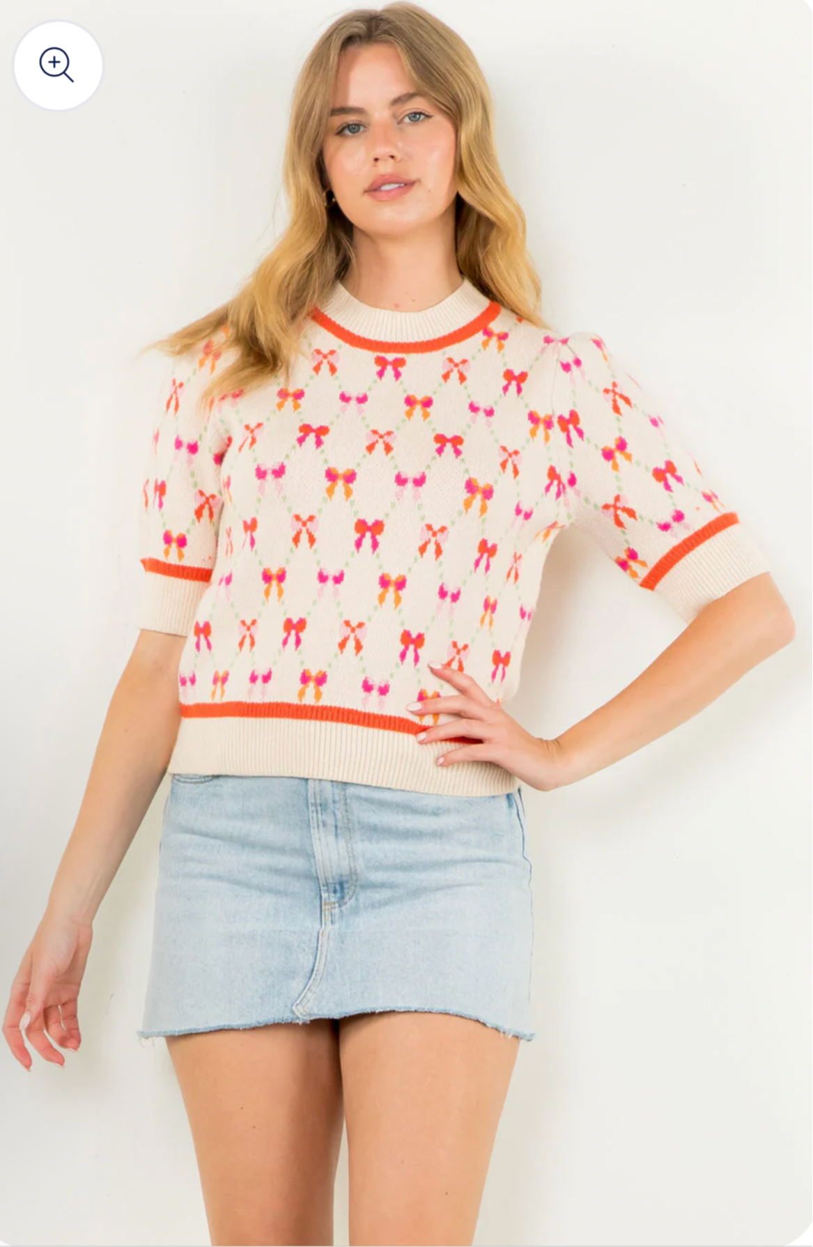 Cream short sleeve knit with orange and pink bows