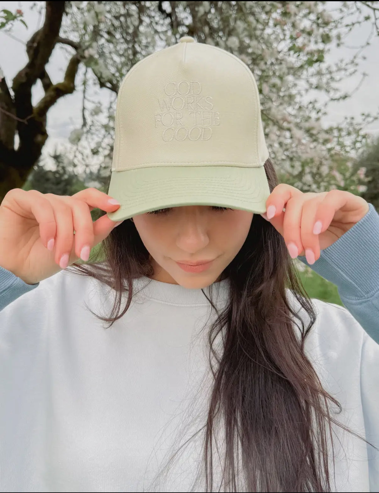 “God works for the good” hat